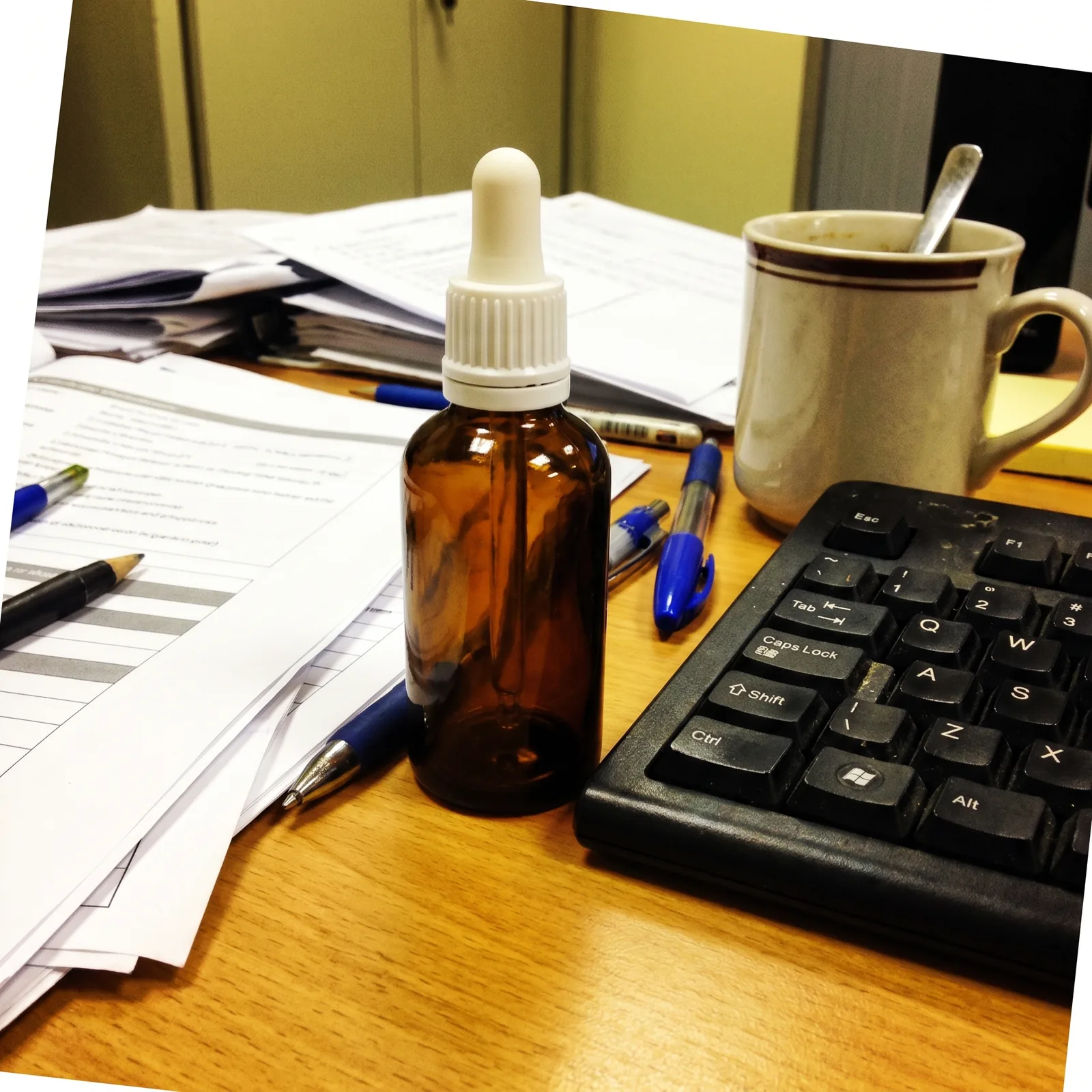 An ordinary phone photo of a serum bottle on a desk